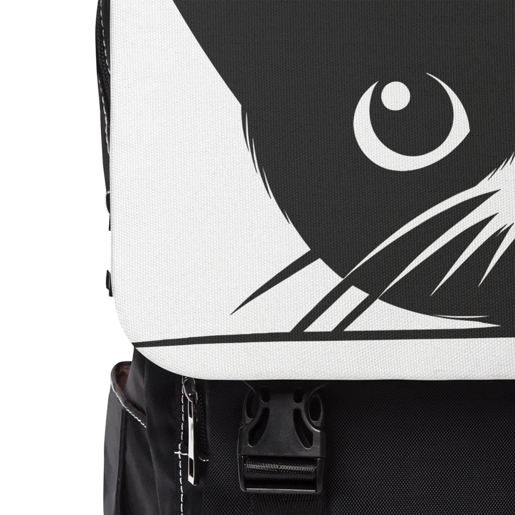 Close-up of Nine Lives cat design backpack by Printify showing black and white cat face print and front buckle