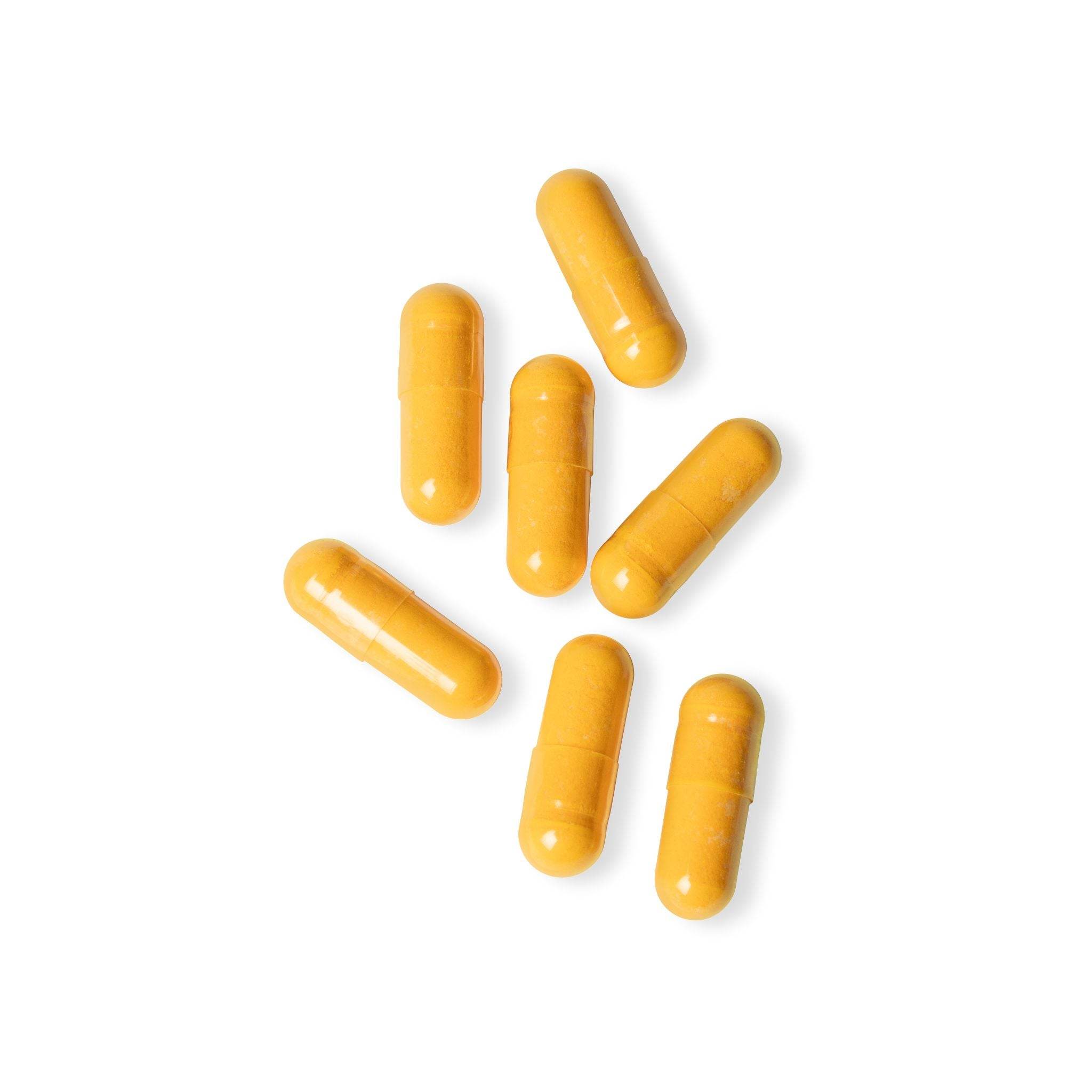 Yellow capsules of vegan CoQ10 supplement by Printify on a white background