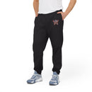 Men wearing black eco Adidas pants with embroidered logo and blue white sneakers from Printify