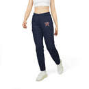 Woman wearing navy eco Adidas pants with embroidered design walking in white sneakers