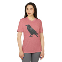 Woman wearing a pink eco-friendly Adidas sport t-shirt with a black crow graphic printed on the front