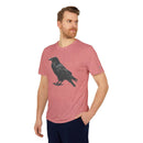 Man wearing a Printify eco-friendly Adidas sport t-shirt in red with a black crow graphic