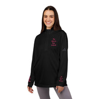 Smiling woman wearing black Printify sweatshirt in eco-friendly embroidered quarter-zip pullover with pink chest