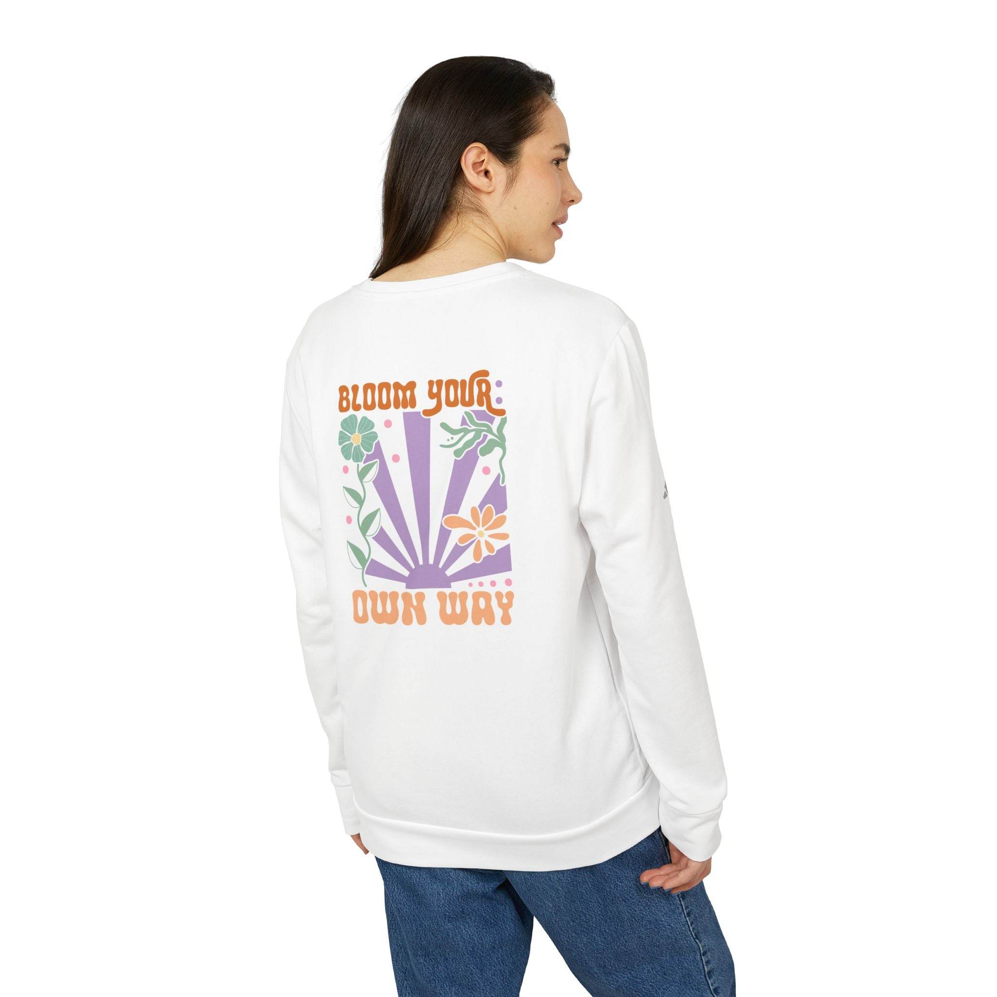 Printify white sweatshirt with colorful floral design and Bloom Your Own Way text eco-friendly sweatshirts for men and women