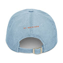 Back view of eco-friendly denim hat by Printify in light blue with adjustable strap and My Backyard text