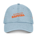 Light blue eco-friendly denim hat with orange Barbecue Capital text embroidered on front