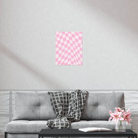 Pink checkered pattern sustainable uncoated posters hanging above gray sofa in modern living room