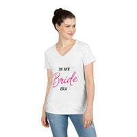 Printify white v neck women t shirt reading In My Bride Era worn by model with jeans eco-friendly bride t-shirt