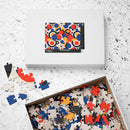 Colorful eco puzzle by Printify with abstract vibrant pieces in blue red black and beige in a box