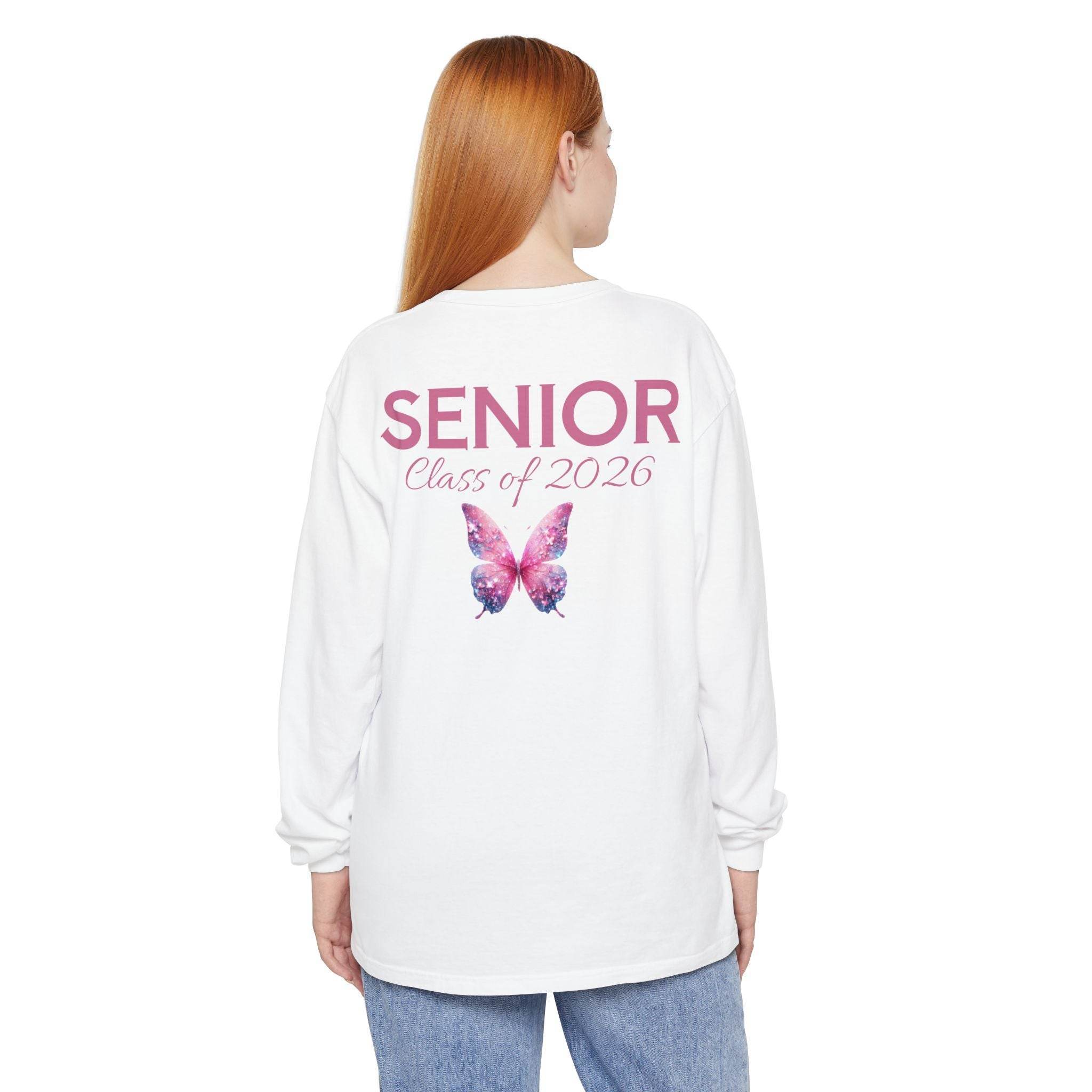 Printify white long sleeve senior class of 2026 shirt with pink butterfly back print on model