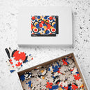 Printify colorful eco puzzle with abstract red blue and beige pieces in open box and white packaging
