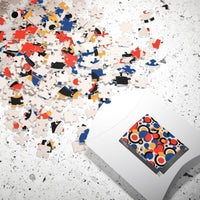 Printify colorful eco puzzle with scattered vibrant pieces and modern abstract design on packaging