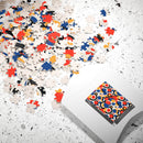 Colorful eco puzzle by Printify with scattered multicolored pieces and packaging on a white surface