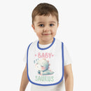 Toddler wearing a dinosaur print baby bib with a cute sleeping dinosaur and blue trim from Printify