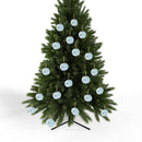 Christmas tree decorated with multiple blue dragonfly christmas ornaments from Printify