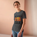 eco friendly halloween t shirt women model wearing charcoal gray tee with orange and black Good Witch print