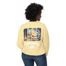 Printify eco-friendly camping sweatshirt pale yellow shown from back with illustrated campsite panels and Camping Life text