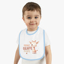 Printify eco-friendly baby bib with cute giraffe design and blue trim worn by toddler