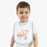 Printify eco-friendly baby bib with cute giraffe design and blue trim worn by toddler