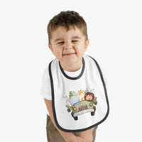 Toddler wearing Printify eco-friendly baby bib with jungle animals in a car design