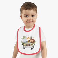 Toddler wearing Printify eco-friendly baby bib with red trim and animal print design