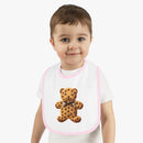 Toddler wearing Printify eco-friendly baby bib with teddy bear cookie design and pink trim