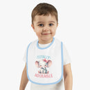 Toddler wearing a Printify eco-friendly baby bib with blue trim and adorable elephant design
