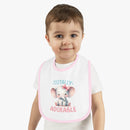 Toddler wearing Printify eco-friendly baby bib with pink trim and cute elephant design