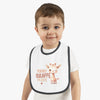 Toddler wearing eco-friendly baby bib with cute giraffe design and text from Printify