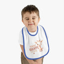 Printify eco-friendly baby bib with cute giraffe design worn by smiling toddler