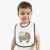 Toddler wearing a Printify eco-friendly baby bib with cute jungle animal design and black trim