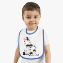 Toddler wearing Printify eco-friendly baby bib with blue trim and cute zebra design