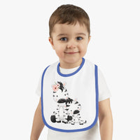 Toddler wearing Printify eco-friendly baby bib with blue trim and cute zebra design