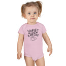 Toddler wearing pink eco-friendly baby onesie with Worlds Cutest Alarm Clock print by Printify
