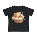Black eco-friendly baby t-shirt by Printify with a cute teddy bear in a flower-adorned basket design