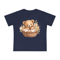 Printify navy eco-friendly baby t-shirt with cute teddy bear in basket and floral design