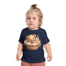 Toddler wearing navy Printify eco-friendly baby t-shirt with teddy bear and floral basket design