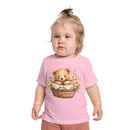 Toddler wearing a pink eco-friendly baby t-shirt with a teddy bear in a basket print from Printify