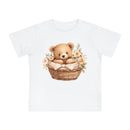 Printify white baby t-shirt with teddy bear in basket and floral design eco-friendly baby t-shirt