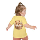 Toddler wearing a yellow eco-friendly baby t-shirt with a teddy bear in a basket print on the back