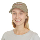 Printify eco-friendly baseball cap in beige with touchdown text worn by smiling woman