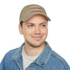 Printify eco-friendly baseball cap in tan with repeated touchdown text worn by smiling man in denim jacket