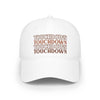 White eco-friendly baseball cap by Printify with repeated brown touchdown text design