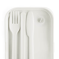 White eco-friendly bento lunch box with matching fork, knife, and spoon kitchen accessories