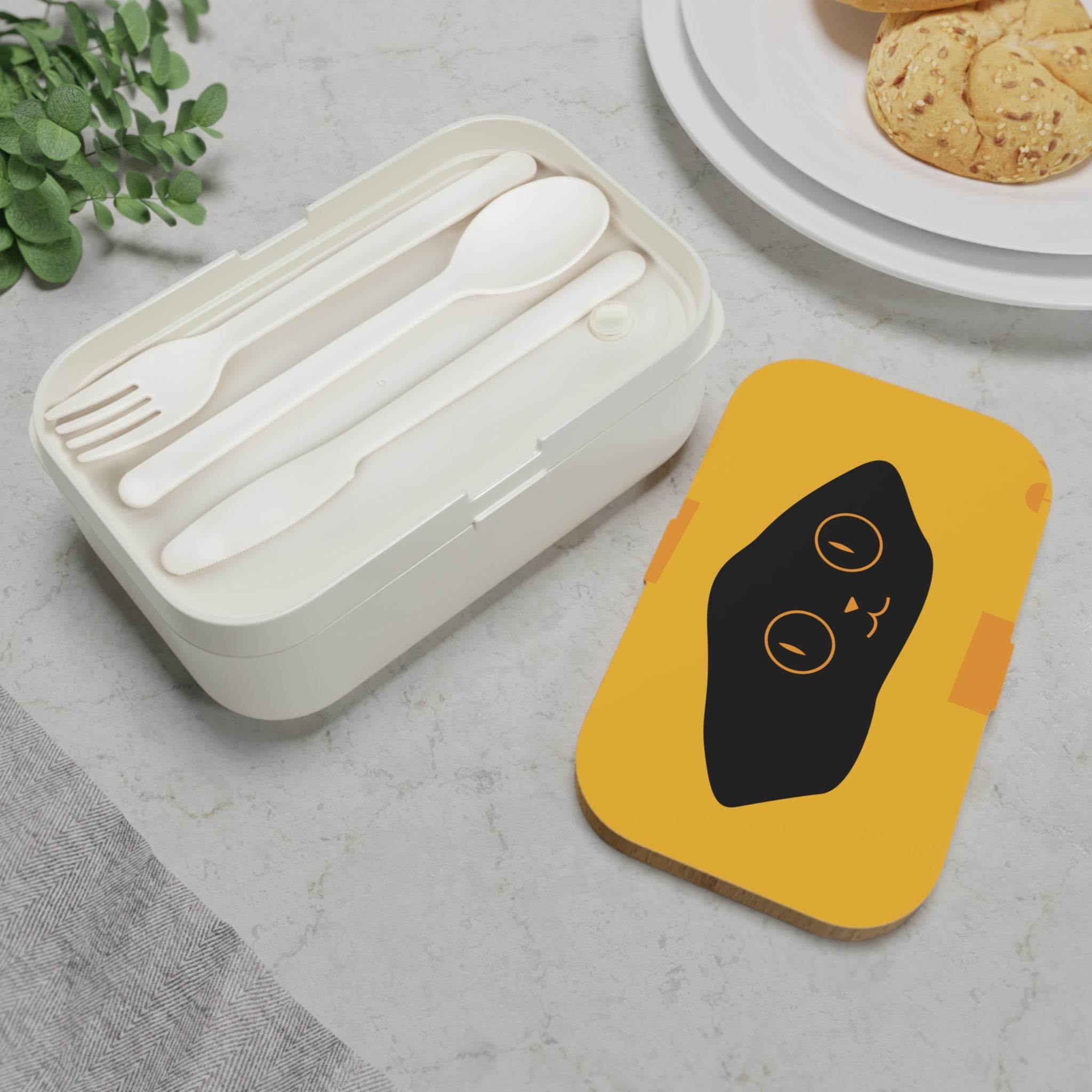 Printify eco-friendly bento lunch box with reusable utensils and a yellow lid featuring a black cat design