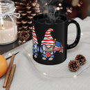 Printify eco-friendly black mug with patriotic gnome holding an American flag on a cozy holiday table