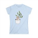 Printify eco-friendly cat lover t-shirt with cat sitting in a potted plant design on light blue fabric