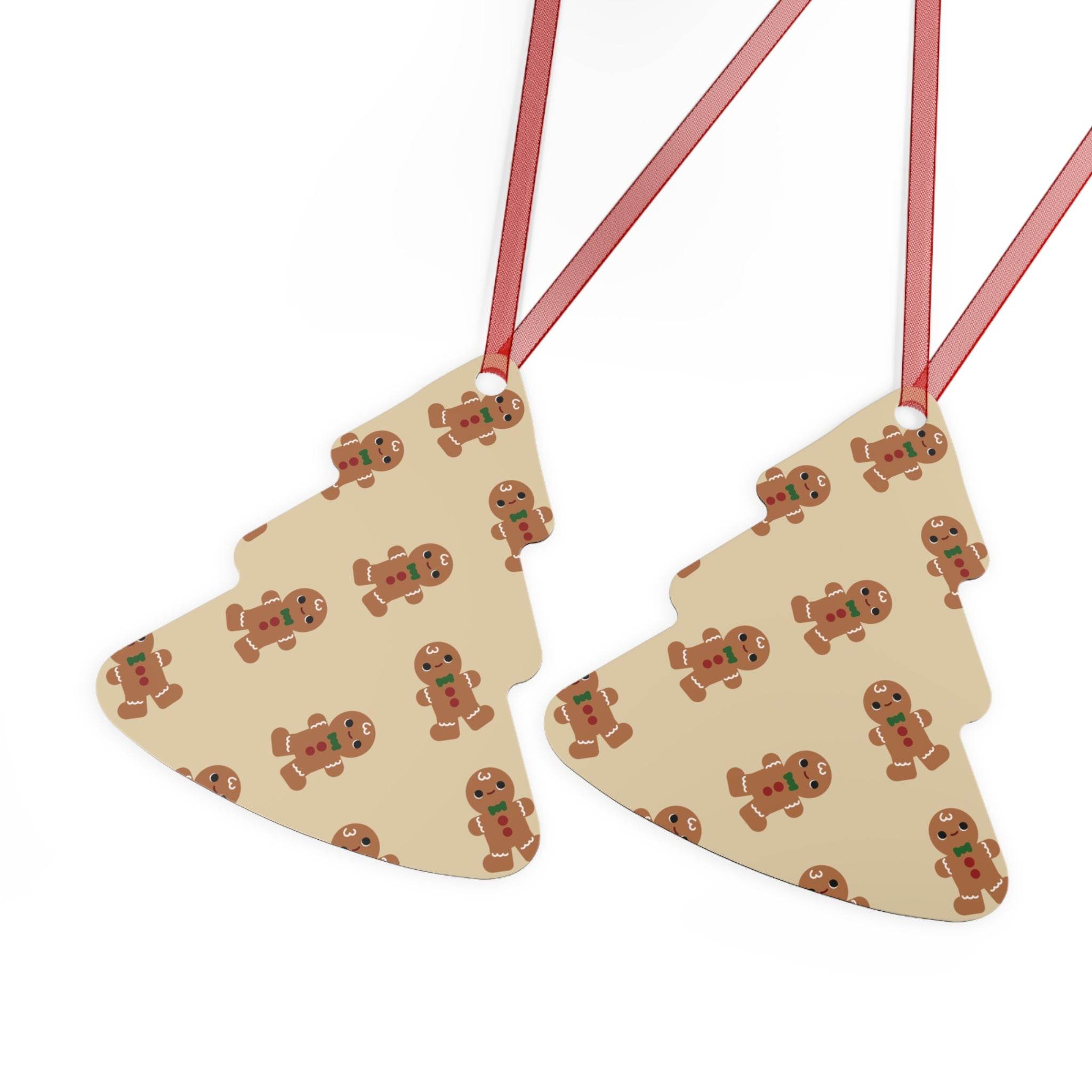 Printify eco-friendly Christmas ornaments shaped like Christmas trees with gingerbread man pattern and red ribbons