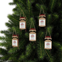 Eco-friendly Christmas ornaments shaped like sleds with Santa hats hanging on pine tree branches