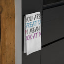 Printify eco-friendly dad tea towel with colorful text hanging on black kitchen cabinet